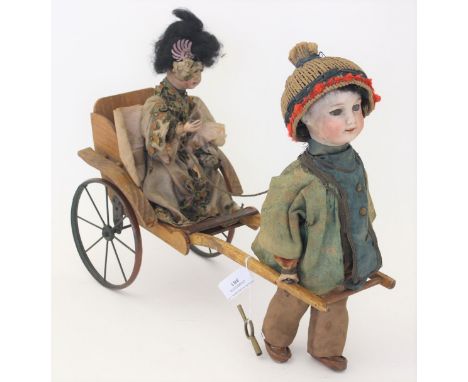 Automaton: A Société Française de Fabrication de Bébés et Jouets (SFBJ) clockwork automation of a walking doll with another i