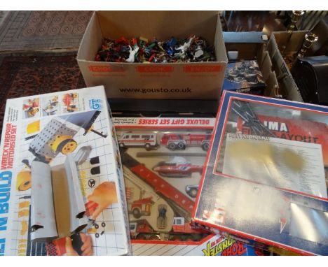Two boxes containing a large quantity of plastic soldiers and other figures, a Lima train set and other similar items.