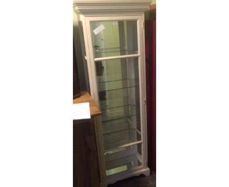 A white painted shop display cabinet, having glazed door and sides enclosing four glass shelves with mirror back. 185cm x 66c