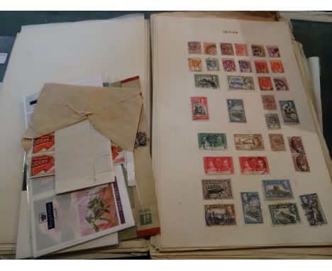 A collection of GB and all world stamps, early to middle period, contained within album, on pieces and first day of issue sta