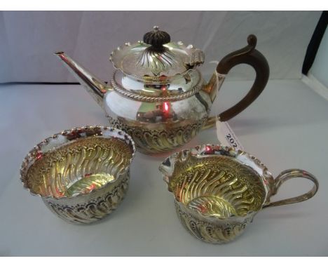 James Deakin &amp; Sons, a silver bachelors tea service, comprising: pot with bakelite hand and angled spout, sugar and loop 