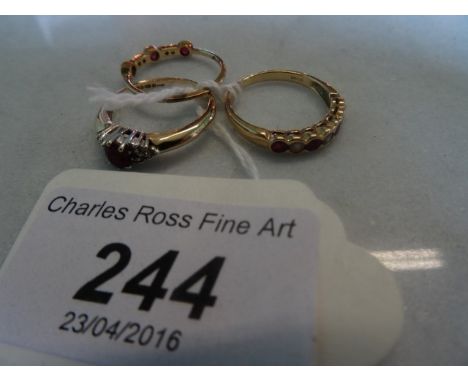 A ruby and diamond half-hoop ring, together with a ruby and diamond half-hoop eternity ring and one other.