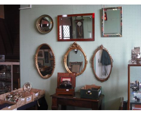 Six wall mirrors, including three gilt composite framed mirrors and a bur yew framed wall mirror with bevelled rectangular pl