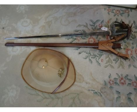 A QE2 Wilkinson Sword with badge for the Bechuanaland Protectorate (now Botswana), together with leather scabbard and policem