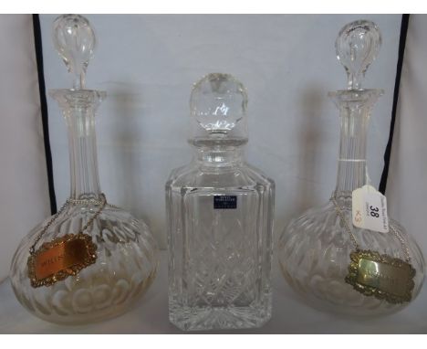 A Royal Worcester decanter and stopper of mallet form, together with two others of onion shape, with EPNS spirit labels.