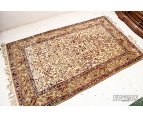 A silk carpet, tree of life with flora and fauna on a beige ground, 170 x 106cm approx.