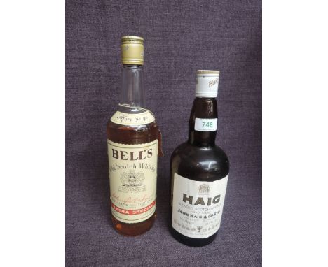 A bottle of Haig Gold Label Blended Scotch Whisky, 70% proof, 26 2/3fl and a bottle of Bells Extra Special Blended Scotch Whi