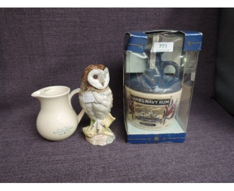 A ceramic flagon of Lambs Navy Rum, HMS Warrior 40% vol, 75cl in window display box along with a Royal Doulton Whyte &amp; Ma