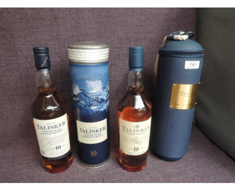 Two bottles of Talisker 10 Year Old Single Malt Scotch Whisky, both 45.8% vol, 70cl one in metal tube with rope top and one i