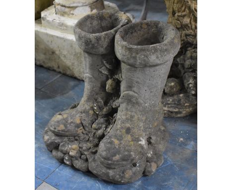 A Reconstituted Stone Garden Planter in the Form of Wellington Boots, 32cms Tall 