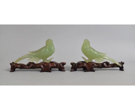 A Cased Chinese Boxed Pair of Jade Effect Birds on Wooden Stands, Both with Condition Issues 