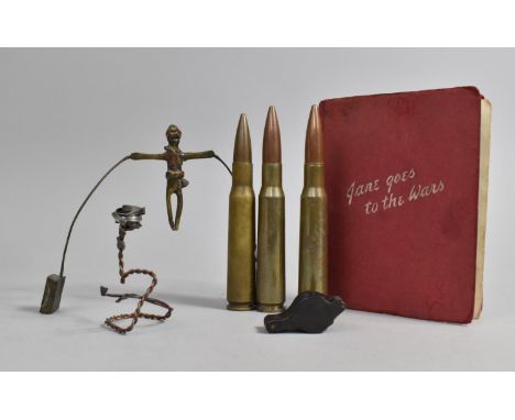 A Collection of WWII and Later Militaria to include Three Spent Shells, Trench Art Tightrope Walker Toy, Jane Goes to Wars Bo