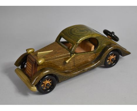 A Modern Wooden Model of a Vintage Car, 37cms Long 