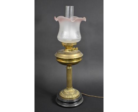 A Brass Table Lamp in the Form of a Victorian Oil Lamp with Ribbed Column Support, 62cms High 