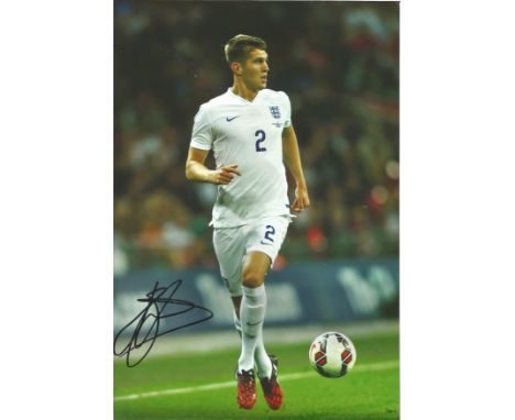 Football John Stones 12x8 signed colour photo in action for England. John Stones (born 28 May 1994) is an English professiona