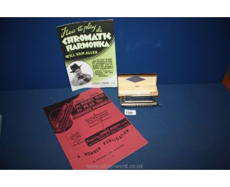 A Hohner chromatic Harmonica in original box with instruction books on how to play