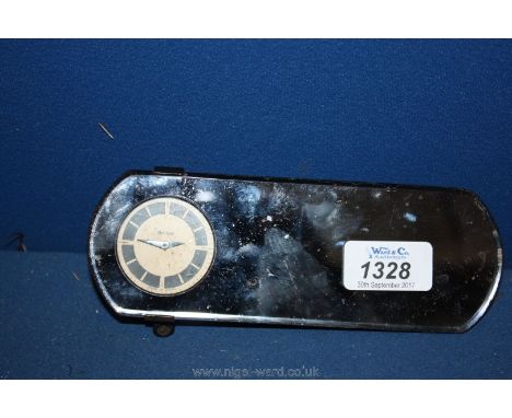 An unusual and collectable ''Mansfield Made in U.S.A.'' tinted motor car rear-view Mirror having an inset timepiece with stri