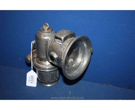 A ''Lucas Calcia Major'' nickel finished Carbide Motorcycle head Lamp having faceted green side prisms and with acetylene tub