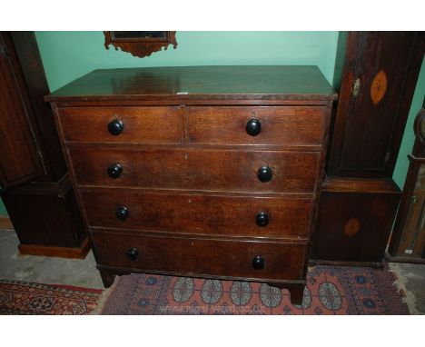 A 19th c. Oak Chest of two short over three long graduated Drawers with Pine linings and ebonised wooden knobs, on bracket fe