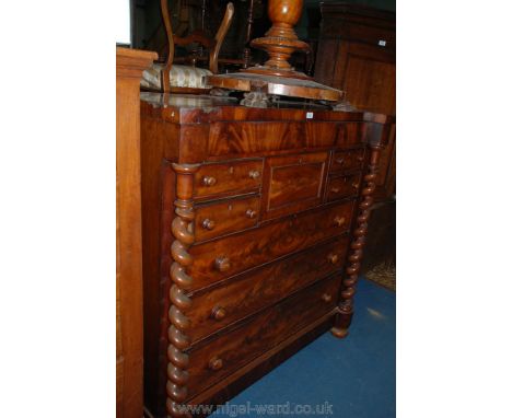 A good Victorian Mahogany Scotch Chest of seven Drawers with barley twist column supports flanking upper secret drawer over t