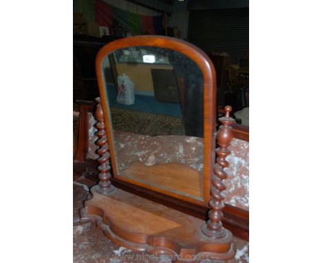 A Victorian Mahogany Toilet Mirror with arch top mirror on barley twist supports and shaped platform base.