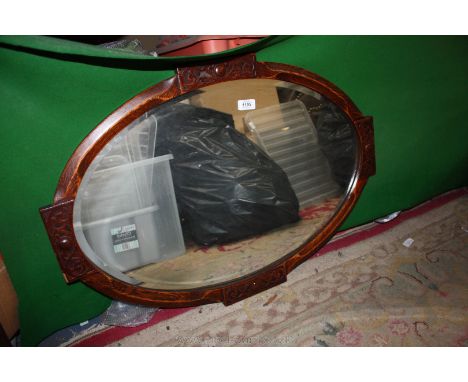 An oval oak framed, arts and crafts style Wall Mirror