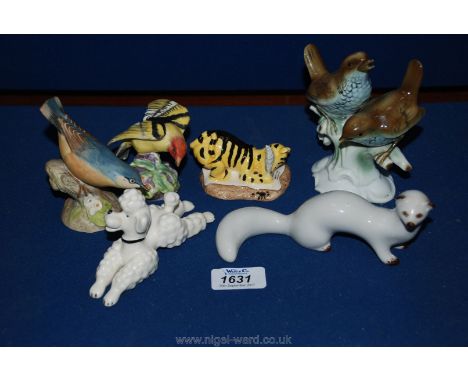 A Royal Doulton figurine 'Tigger signs the Resolution', a USSR Stoat, a West German Poodle, a Royal Worcester Tanager, etc 