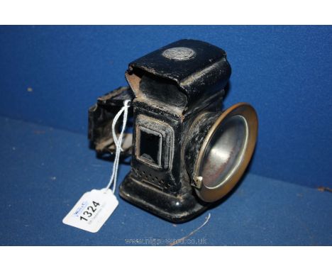 An early Lucas Paraffin fired Bicycle Lamp having black painted finish and wick burner, the case incorporating rectangular gr