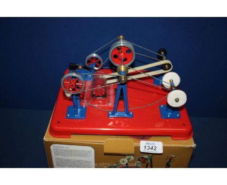 A boxed "Mamod Workshop WS1" as new, rigged up with a small battery-powered motor drive and electric light and featuring an o