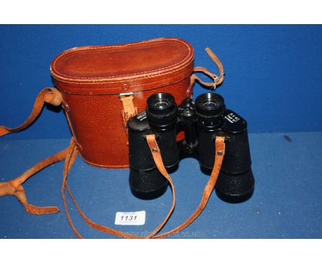 A pair of Dolland coated lens Binoculars with leather case