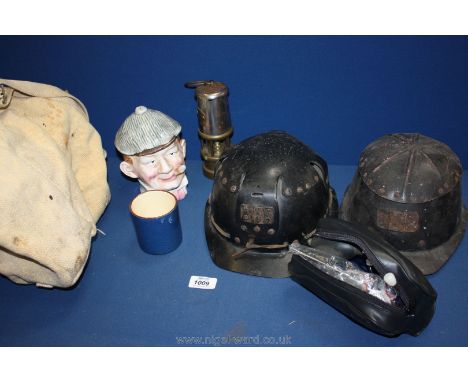 Two miner's helmets, Davy lamp, an old blood pressure monitor, etc. 