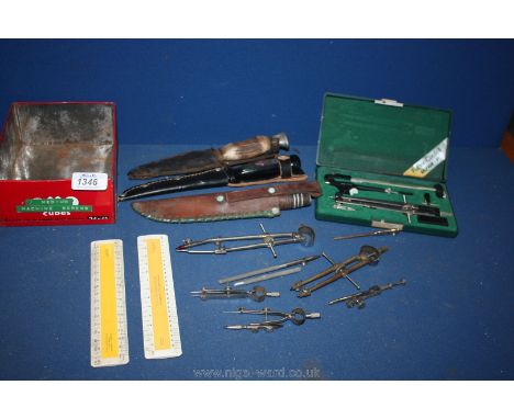 An old OXO tin containing a cased "Faber-Castell Ultra P" drawing instrument set, other odd drawing instruments, two small sc