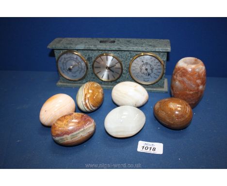 Six onyx eggs, a Slate Clock/barometer/thermometer and an Onyx Vase.