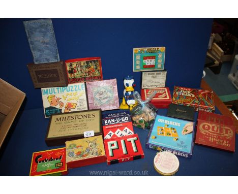 A box of Games together with a Marx 'Donald Duck' toy