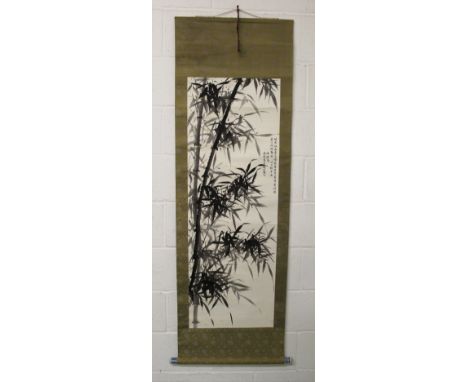 A 20TH CENTURY CHINESE HANGING SCROLL PAINTING ON PAPER, within a patterned silk border, and with porcelain end pieces, the p