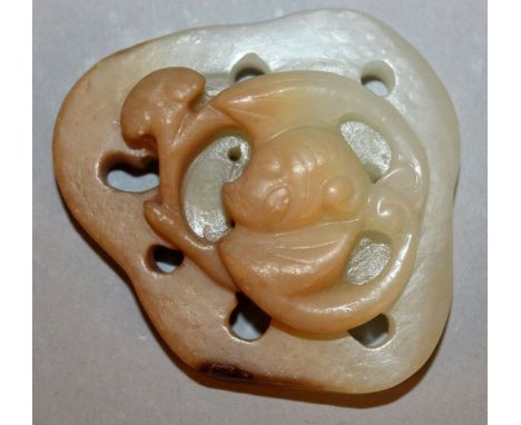A CHINESE CELADON GREEN JADE-LIKE CARVING, of pierced and shaped form it’s top surface decorated in high relief with a bat an