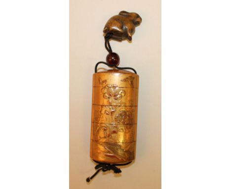 A 19TH CENTURY JAPANESE MEIJI PERIOD FOUR CASE LACQUER INRO & WOOD NETSUKE, the inro with a red seal to its lower case and de