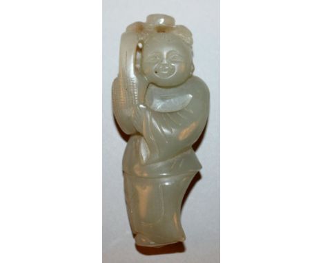 AN 18TH/19TH CENTURY CHINESE DARK CELADON JADE CARVING OF A STANDING WOMAN, holding up a basket to one shoulder, 2.75in high.