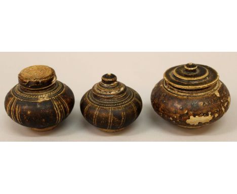 THREE SONG DYNASTY BROWN GLAZED CERAMIC JARS, with non-matching covers, the largest jar 2.1in high without cover. (3)