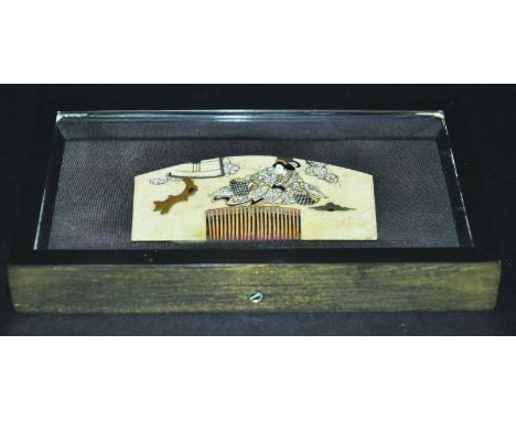 A FRAMED & MOUNTED JAPANESE MEIJI PERIOD LACQUERED IVORY COMB, circa 1900, decorated with a geisha beneath a blossoming tree,