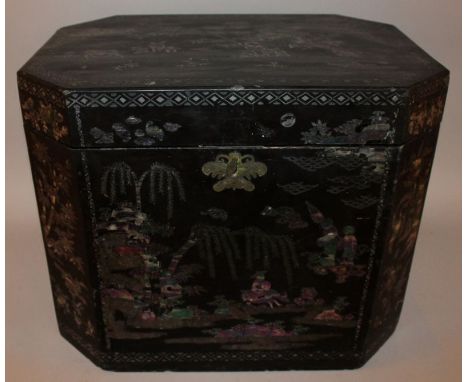 AN UNUSUAL EARLY 19TH CENTURY CHINESE LAC BURGAUTE INLAID CHEST, of chamfered rectangular section, the sides with mother-of-p