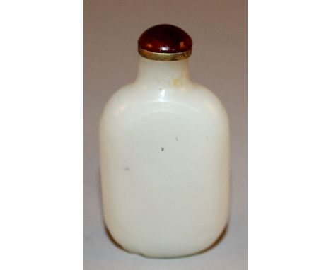 A CHINESE WHITE JADE-LIKE SNUFF BOTTLE & STOPPER, of plain flattened ovoid form, 2.7in high.