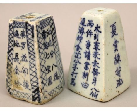 TWO 19TH CENTURY CHINESE BLUE & WHITE PROVINCIAL PORCELAIN JOSS STICK HOLDERS, each bearing calligraphy, each base unglazed, 