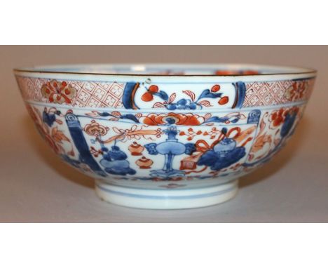 A CHINESE IMARI KANGXI PERIOD PORCELAIN BOWL, early 18th Century, the sides painted with scroll-form panels of precious objec