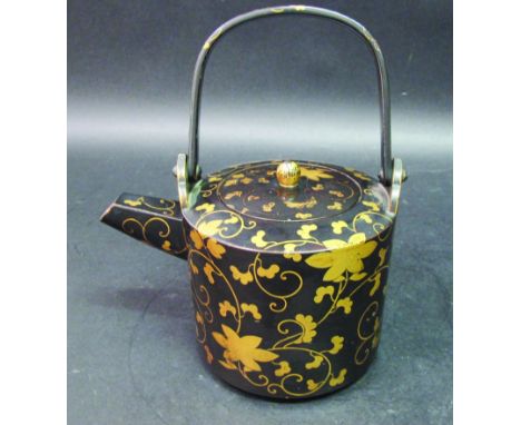 A JAPANESE MEIJI PERIOD LACQUER EWER & COVER, with overhead swing handle, decorated with an overall design in gold lacquer of