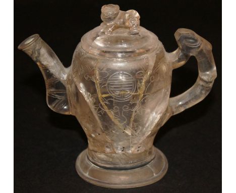 A 19TH CENTURY CHINESE ROCK CRYSTAL TEAPOT & COVER, the sides engraved with shou symbols, lingzhi and pine, the cover carved 