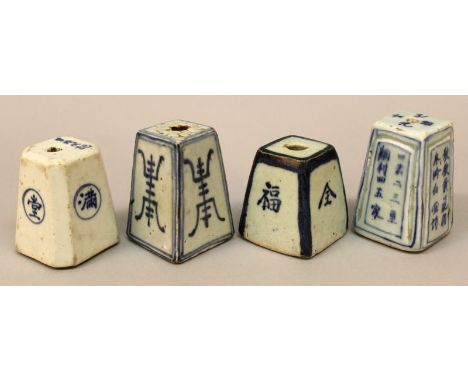 A GROUP OF FOUR 19TH CENTURY CHINESE BLUE & WHITE PROVINCIAL PORCELAIN JOSS STICK HOLDERS, each bearing calligraphy, each bas