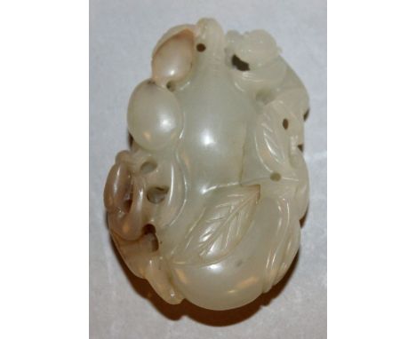 A CHINESE CELADON-GREEN JADE-LIKE PENDANT, in the form of two monkeys clambering on gourds, 2in high.