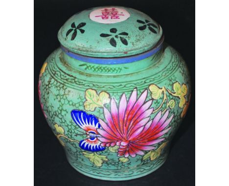 A 19TH/20TH CENTURY CHINESE YIXING ENAMELLED POTTERY JAR & COVER, the sides decorated with flowers and a butterfly reserved o
