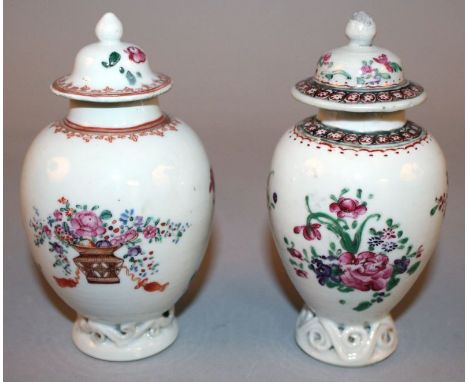 TWO 18TH CENTURY CHINESE FAMILLE ROSE PORCELAIN TEA CADDIES & COVERS, each painted with floral sprays and supported on a moul